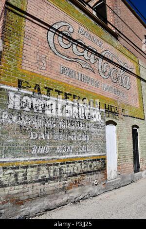 Layers of old painted advertisements in Salida Stock Photo
