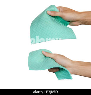 Hand holding green microfiber chamois isolated on white background. Clipping path. Microfiber use for cleaning. Multi Purpose Cloth. Hand hold green c Stock Photo