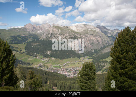 The Geisler Gruppe Gruppo Delle Odle viewed from hay meadows across the Val Gardena at the foot of The Langkofel  or Sassolungo Selva Dolomites Italy Stock Photo