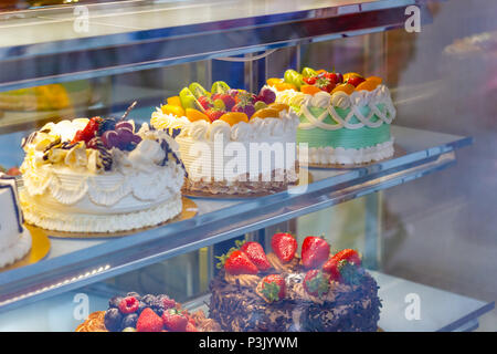 Beautifully decorated cakes on display at a bakery shop in London Chinatown Stock Photo