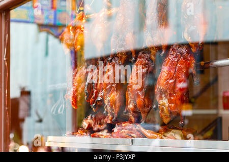 Rows of roast ducks on display at a Chinese restaurant in London Chinatown Stock Photo