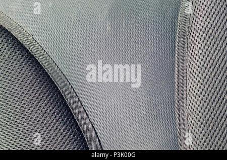 closeup of texture breathable mesh fabric in the black photo backpack. Texture of Black Plastic Weave Bag. Background image Stock Photo