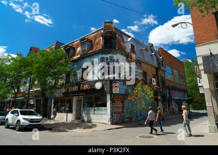 Pedestrians crossing De Bullion stret at the corner of Ste Catherine, downtown Montreal, province of Quebec, Canada. Stock Photo