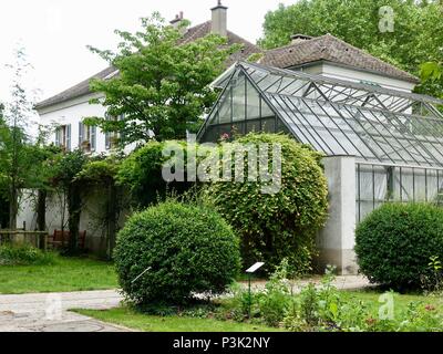 Greenhouse attached to building located in the middle of Bercy Park, Paris, France Stock Photo
