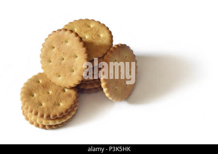 Classic round golden yellow salted cracker isolated on over white background Stock Photo