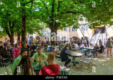 Salzburg: brewery restaurant beer garden Augustiner Bräustübl Mülln, blossoming chestnut trees in Austria, Salzburg, Stock Photo