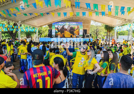 Campo Grande, Brazil - June 17, 2018: Brazilians at a free entrance event organized by the prefecture to watch the world cup on a downtown square of t Stock Photo