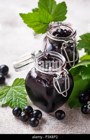 Black currant jam in jar Stock Photo