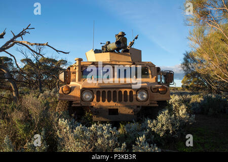 A Combined Anti-Armor Team humvee moves into a screening position during Exercise Hamel at Cultana Training Area, South Australia, Australia, July 6, 2016. Exercise Hamel is a trilateral training exercise with Australian, New Zealand, and U.S. forces to enhance cooperation, trust, and friendship. The Marines are with Weapons Company, 1st Battalion, 1st Marine Regiment, Marine Rotational Force – Darwin. (U.S. Marine Corps photo by Cpl. Carlos Cruz Jr./Released) Stock Photo