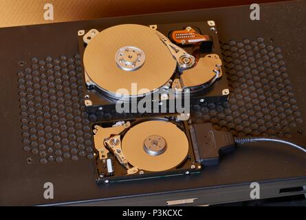 A 3.5 inch desktop and a 2.5 inch laptop hard disk side by side Stock Photo