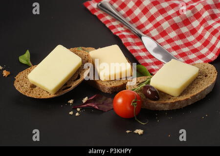 Slices of bread with cheese on top of them Stock Photo