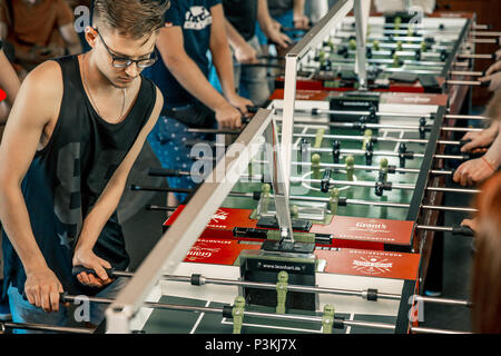 KYIV, UKRAINE, bar league of Grants KickerKicker 10 June 2018. Active men and women have fun during table soccer game. Competitions and qualifying rou Stock Photo