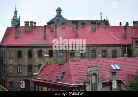 Fragment of a metal roof of the restored old multi-storey building in Lviv, Ukraine Stock Photo