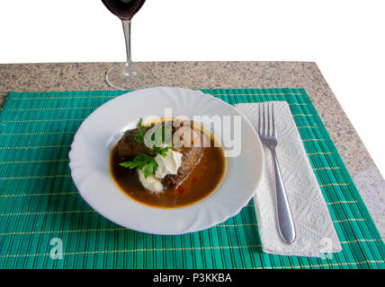 Turkish dish dolma (sarma), rice with meat wrapped in grape leaves in the plate Stock Photo