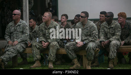 U.S. Marines and Sailors with Task Force Koa Moana and U.S. Navy Seabees attend a welcoming ceremony put on by the students and staff from St. John’s College, Ovalau, Fiji, July 3, 2016, as part of the task force’s deployment in the Asia-Pacific region. The task force is conducting vertical construction training with the Seabees and Fijian engineers at the school and infantry training, with the Republic of Fiji Military Forces, on the island to increase interoperability and relations. The Marines and Sailors with the task force are originally assigned to I and III Marine Expeditionary Force. T Stock Photo