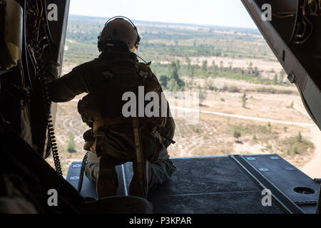 Special forces from Spain land on a beach from a military helicopter as