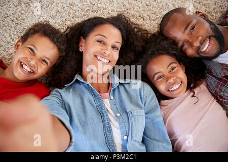 Point Of View Shot Of Parents And Children Posing For Selfie Stock Photo
