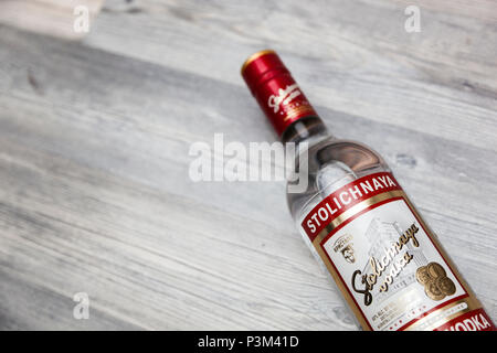 Chisinau, Moldova 18 June 2018: A bottle of Stolichnaya vodka on an wooden background. Russian traditional alcoholic beverage, produced in Russia at C Stock Photo