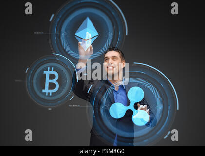 businessman with cryptocurrency holograms Stock Photo