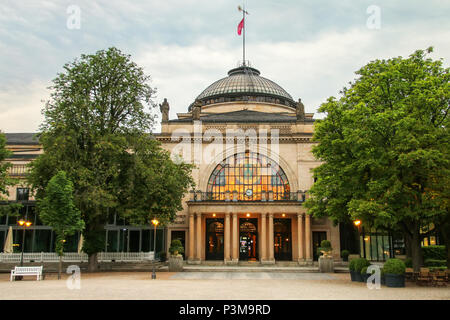 View of Kurhaus from Kurpark in Wiesbaden, Hesse, Germany. Wiesbaden is one of the oldest spa towns in Europe Stock Photo