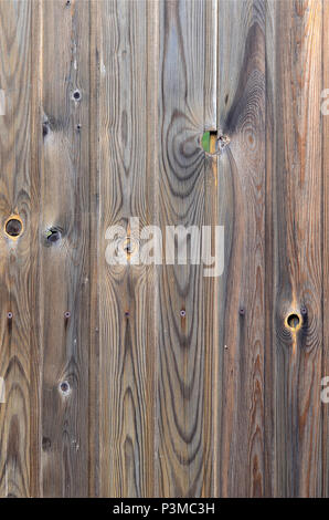 Old grunge dark brown wood panel pattern with beautiful abstract grain surface texture, vertical striped background or backdrop in architectural mater Stock Photo