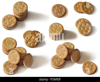 Classic round golden yellow salted cracker isolated on over white background Stock Photo