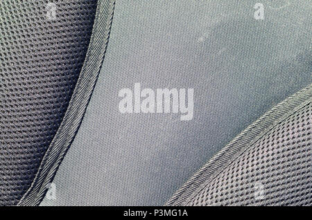 closeup of texture breathable mesh fabric in the black photo backpack. Texture of Black Plastic Weave Bag. Background image Stock Photo