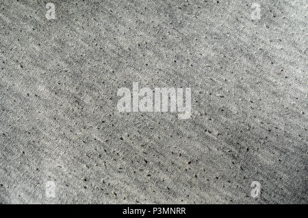 Real heather grey knitted fabric made of synthetic fibres textured background Stock Photo