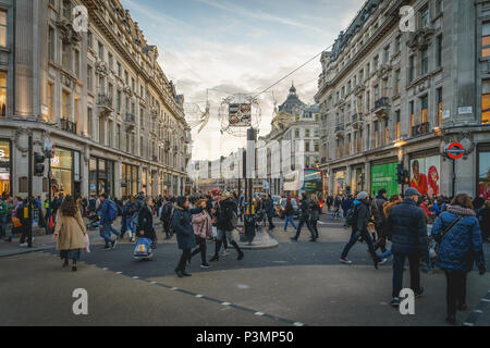 London, UK - November 2017. Decorated Oxford Circus crowded with people shopping for Christmas. Landscape format. Stock Photo