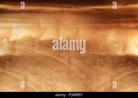 Scratched texture copper plating background close-up Stock Photo