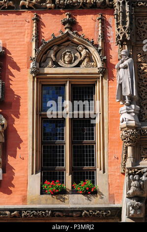 Architectural details and statues on neo-Gothic Town Hall or Ratusz in Wroclaw's market Square. Poland June 2018 Stock Photo