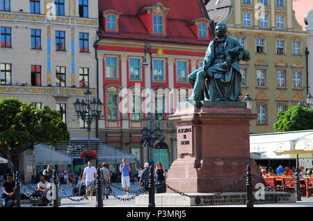 The statue of playwright earl Alexander Fredro in the medieval market square of the Rynek in Wroclaw, Poland. Stock Photo