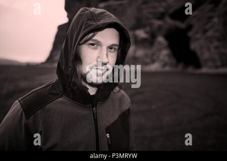 Hooded man in Iceland Stock Photo