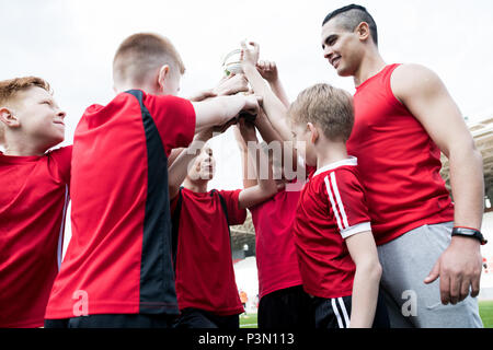 Junior Football Team Celebrating Victory Stock Photo