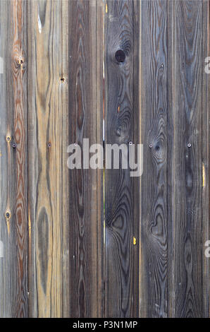 Old grunge dark brown wood panel pattern with beautiful abstract grain surface texture, vertical striped background or backdrop in architectural mater Stock Photo