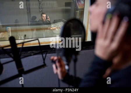 Operator working with singer in studio Stock Photo