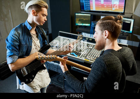 Coworking musicians in recording studio Stock Photo