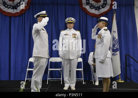 Lt. Cmdr. Matthew J. Meskun as he relieves Cmdr. Nicole D. Rodriquez as the commanding officer of Coast Guard Coast Guard Marine Safety Unit Baton Rouge during a change-of-command ceremony at the Port of Baton Rouge, July 15, 2016. Meskun previously served as the Inspections Division Chief of Coast Guard Sector San Juan.   -  U.S. Coast Guard photo by Petty Officer 3rd Class Lexie Preston. Stock Photo