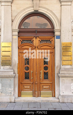 Big Arch Double Wooden Doors in Trieste Stock Photo - Alamy