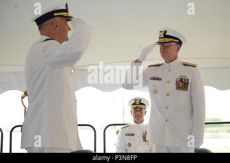 NEW YORK – Capt. Andrew Tucci accepts responsibility of Sector Long Island Sound from Rear Adm. Steven Poulin, commander First Coast Guard District, in New Haven, Connecticut, July 8, 2016. The sector includes approximately 500 active duty, 200 reservists and 1,200 volunteer Coast Guard Auxiliary members. (U.S. Coast Guard photo by Petty Officer 3rd Class Steve Strohmaier) Stock Photo