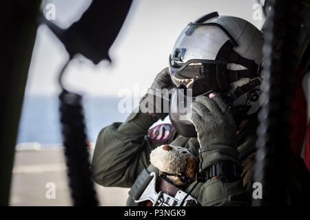US Navy An air crewman checks a JP-5 aviation fuel sample for an HH-60H ...