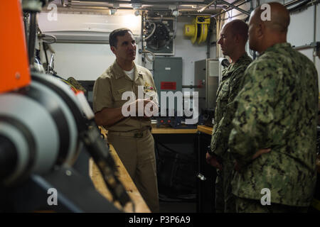 160715-N-WO404-087  SAN DIEGO (July 15, 2016) Rear Adm. Frank Morneau, Commander, Navy Expeditionary Combat Command, speaks with Sailors assigned to Expeditionary Mine Countermeasures Team 153, about the Mk 18 Mod 2 Kingfish Unmanned Underwater Vehicle, used for hunting mines, foreground, while touring the littoral combat ship USS Freedom (LCS 1) during the Southern California portion of Rim of the Pacific 2016. Twenty-six nations, more than 40 ships and submarines, more than 200 aircraft and 25,000 personnel are participating in RIMPAC from June 30 to Aug. 4. The world’s largest maritime exer Stock Photo
