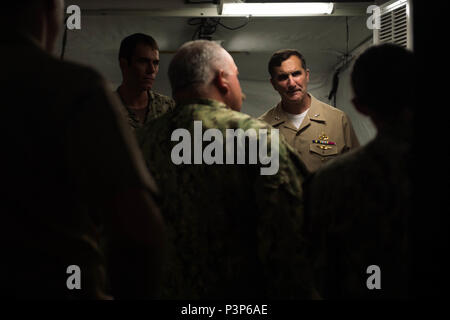 160715-N-WO404-139  SAN DIEGO (July 15, 2016) Rear Adm. Frank Morneau, Commander, Navy Expeditionary Combat Command, speaks with Sailors assigned to Expeditionary Mine Countermeasures Team 332 while touring the littoral combat ship USS Freedom (LCS 1) during the Southern California portion of Rim of the Pacific 2016. Twenty-six nations, more than 40 ships and submarines, more than 200 aircraft and 25,000 personnel are participating in RIMPAC from June 30 to Aug. 4. The world’s largest maritime exercise, RIMPAC provides a unique training opportunity that helps participants foster and sustain th Stock Photo