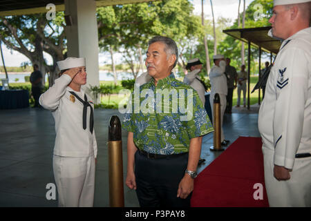 160721-N-AV234-023 PEARL HABOR (July 21, 2016) Governor of Hawaii David Y. Ige is rendered honors by side boys as he arrives Historic Hickam Officers’ Club at Joint Base Pearl Harbor-Hickam for a lease signing ceremony between the Department of the Navy and Hawaii Electric Company.  The DON and Hawaii Electric Company are developing a solar facility on JBPHH. The project will enable the DON to meet critical energy and security goals as well as further Hawaiian Electric’s commitment to renewable energy to the state. (U.S Navy Photo by Mass Communications Specialist 2nd Class Somers Steelman/REL Stock Photo