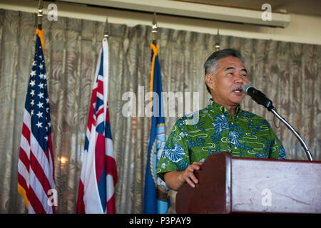 160721-N-AV234-119 PEARL HABOR (July 21, 2016) Governor of Hawaii David Y. Ige speaks at Historic Hickam Officers’ Club at Joint Base Pearl Harbor-Hickam during a lease signing ceremony between the Department of the Navy and Hawaii Electric Company.  The DON and Hawaii Electric Company are developing a solar facility on JBPHH. The project will enable the DON to meet critical energy and security goals as well as further Hawaiian Electric’s commitment to renewable energy to the state. (U.S Navy Photo by Mass Communications Specialist 2nd Class Somers Steelman/RELEASED) Stock Photo