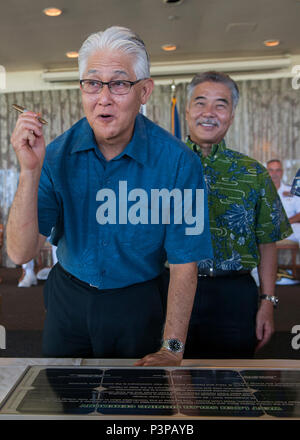160721-N-AV234-172 PEARL HABOR (July 21, 2016) President and CEO of Hawaii Electric Company Alan M. Oshima, left, and Governor of Hawaii David Y. Ige prepare to sign a lease agreement between the Department of the Navy and Hawaii Electric Company at Historic Hickam Officers’ Club at Joint Base Pearl Harbor-Hickam.  The DON and Hawaii Electric Company are developing a solar facility on JBPHH. The project will enable the DON to meet critical energy and security goals as well as further Hawaiian Electric’s commitment to renewable energy to the state. (U.S Navy Photo by Mass Communications Special Stock Photo