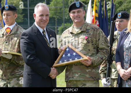 ANSBACH, Germany (July 21, 2016) – Michael D. Formica, director of Installation Management Command – Europe, thanks Col. Christopher M. Benson, outgoing commander of U.S. Army Garrison Ansbach, for Benson’s service and performance. Benson’s retirement ceremony followed the USAG Ansbach change of command Monday at Barton Barracks here. Stock Photo