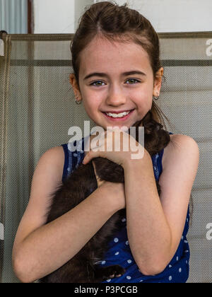 Portrait of a young girl with her cat. Stock Photo