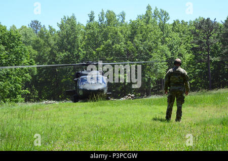 Soldiers attending the Infantryman Advanced Leader Course at the 183rd Regiment, Regional Training Institute assault an urban operations training site May 8, 2017, at Fort Pickett, Virginia. The course aims to teach infantry leaders the skills required to operate as platoon sergeants and focuses on a variety advanced of infantry leadership skills. The two-week course included approximately 40 Soldiers from both the active and reserve components. Stock Photo