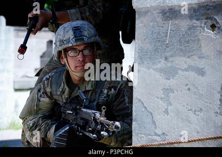 Soldiers attending the Infantryman Advanced Leader Course at the 183rd Regiment, Regional Training Institute assault an urban operations training site May 8, 2017, at Fort Pickett, Virginia. The course aims to teach infantry leaders the skills required to operate as platoon sergeants and focuses on a variety advanced of infantry leadership skills. The two-week course included approximately 40 Soldiers from both the active and reserve components. Stock Photo